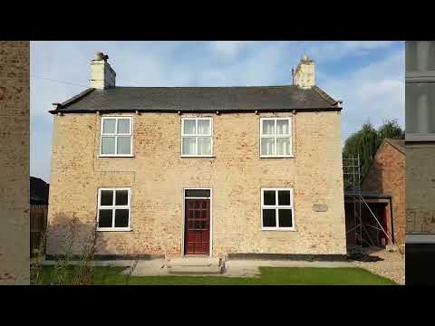 Removing the render from a damp house.