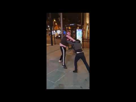 Bizarre moment feeble street scrap escalates as man hurls dead pigeon at rival
