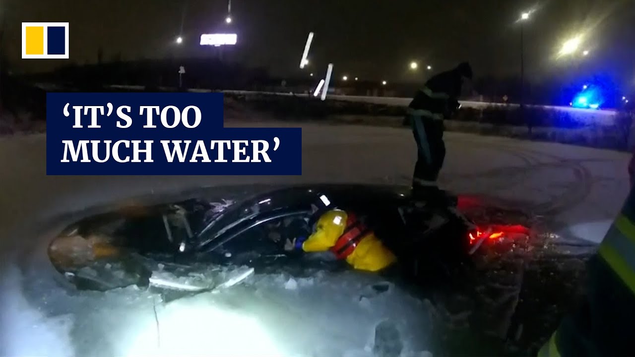 Video shows dramatic rescue of woman trapped in car sinking into frozen ...