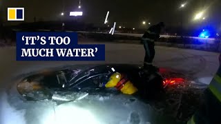 Video shows dramatic rescue of woman trapped in car sinking into frozen pond during US blizzard