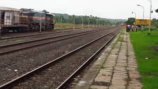 22120 Tejas Express skips Kolad while a humming WDG 4 looks on