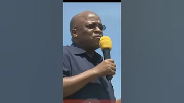 PRESIDENT MAGUFULI EATING INDIAN CORN WHILE LISTING TO TANZANIANS 