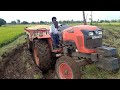 Kubota MU4501 2wd tractor with fully loaded trolley of harvested paddy | Kubota tractor stuck in mud