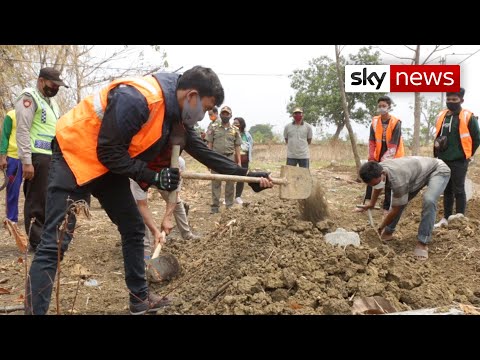 Coronavirus: People caught without masks forced to dig graves and get into coffins.