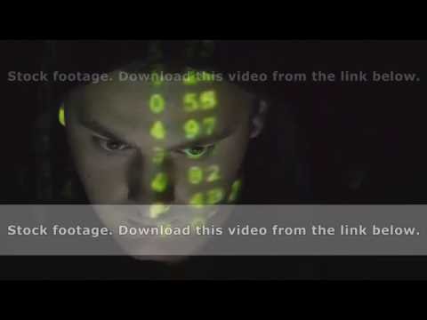Source code projected over an angry hostile man's face, black background.