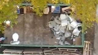 Man Throwing Toilet In Garbage 2
