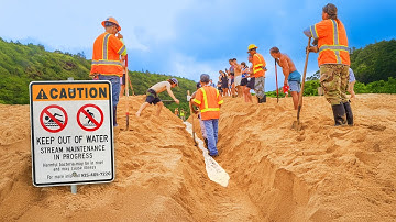 CITY WORKERS CONNECT RIVER TO OCEAN