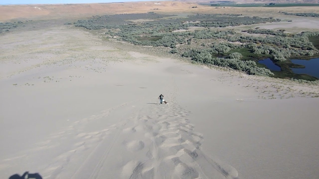 James Hatchett tries sand sledding