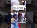Japan fans show off outfits for World Cup match vs. Netherlands in Dallas