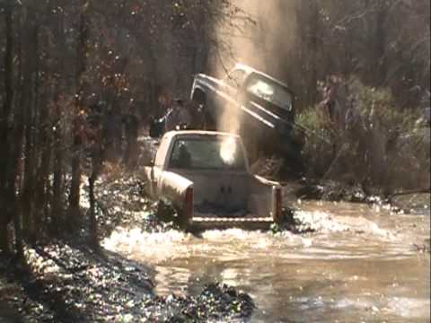 2004 2500 CHEVY TRUCK ON TRACTOR TIRES STUCK DEEP