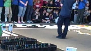 11,000 dominoes topple in just 2 minutes!