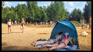 St Petersburg, Russia. Lake Valkijärvi beach. Swimming in the lake 12.07.2021