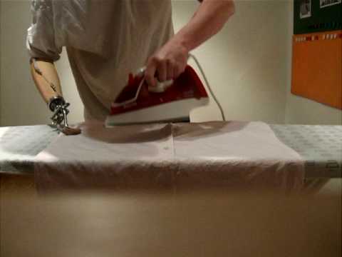 Ironing a shirt using Otto Bock hook prosthesis