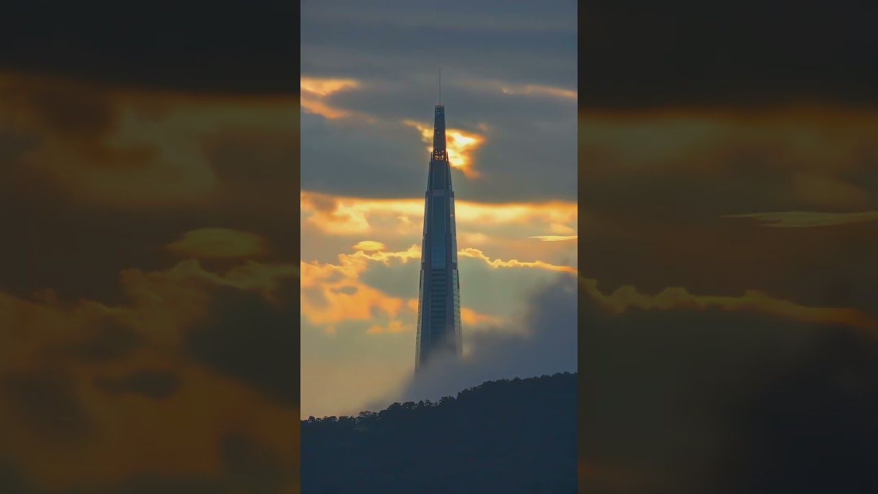 tower above the clouds at golden hour with soft atmospheric light ambience