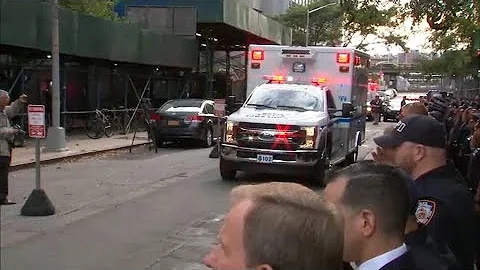 NYPD salutes body of slain officer Brian Mulkeen d...
