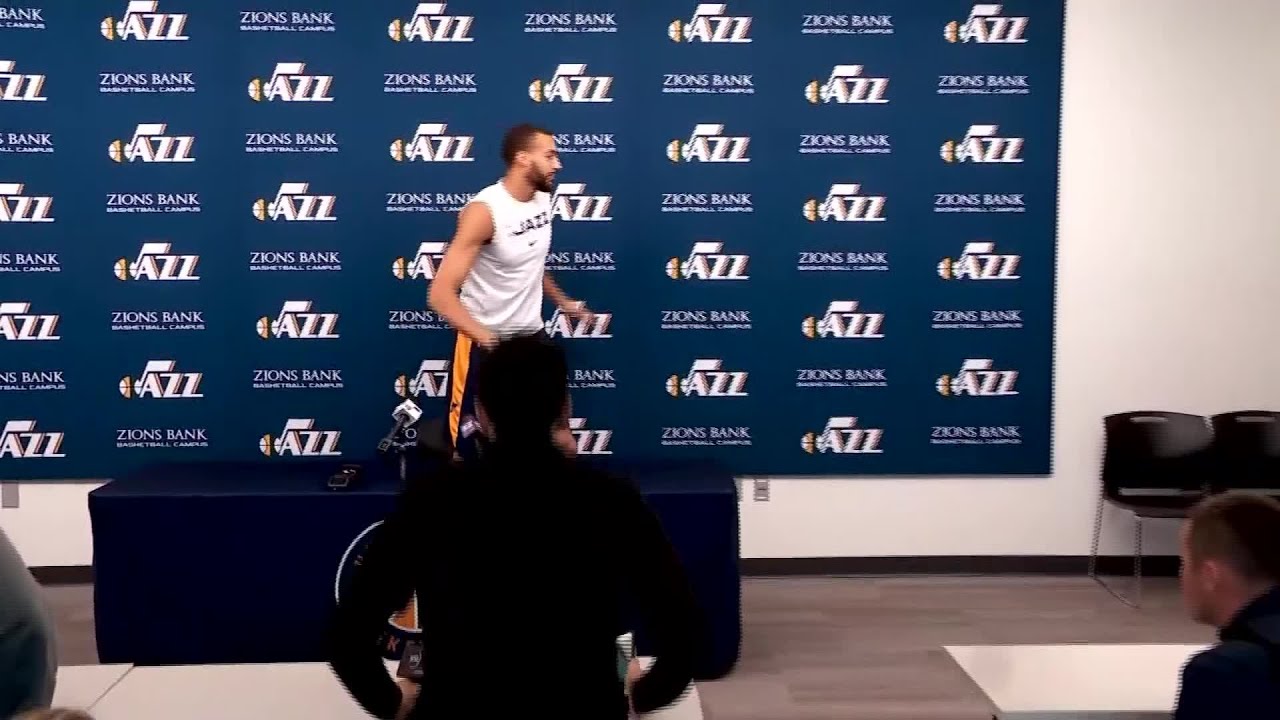 Rudy Gobert touching microphones