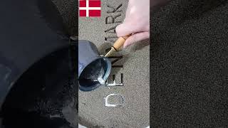 The Art Of Creative Handicraft Metal Casting Of Denmark Letters In Sand