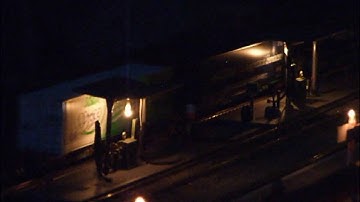 DRS Class 66 passes through the fueling depot with a shot, late night container train.