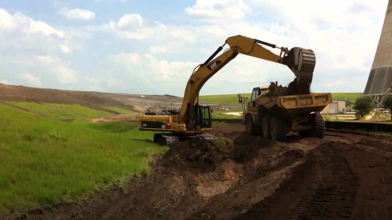 Caterpillar 336D excavator digging ditch YouTube
