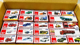 Box full of various miniature cars Peugeot, Volvo, Renault, Hyundai, Pagani, Cadillac One, DHL