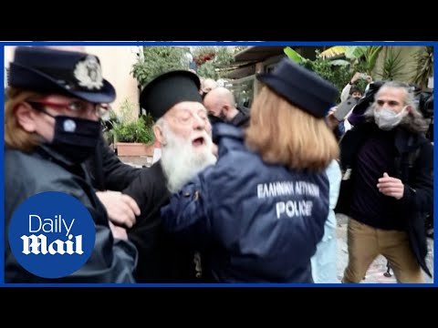 'Pope, you are a heretic!' Police tackle heckling Orthodox priest