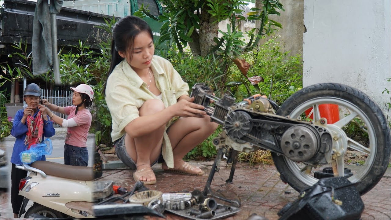 Multi-talented repair girl: Repairing, replacing pistons on a motorbike with automatic transmission