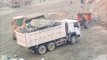 Caterpillar loadar 966D big rocks loading dampers and trolleys#foryou#youtube#rock#stone#caterpillar