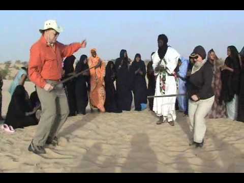 Tuareg women musicians with strange dancers, Timbuktu, Mali