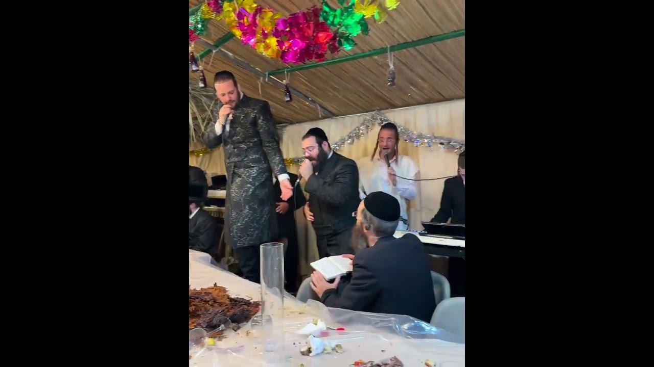 Mezibuz Rebbe Blessings Petitioners in his sukkah