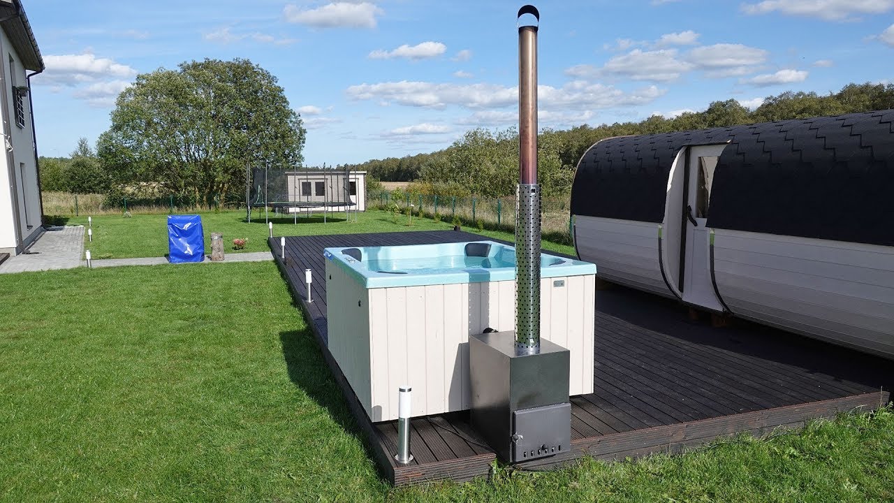 Fibreglass wood fired hot tub with external heater. Top quality wood