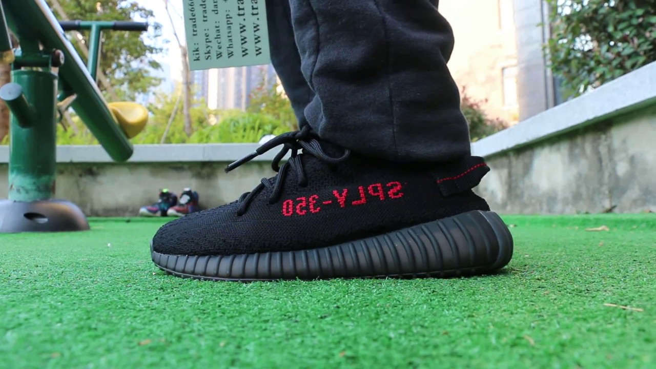 yeezy red stripe on feet