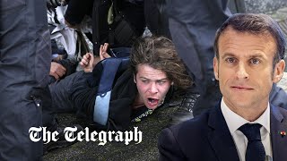 video: Watch: Dramatic moment protester is bundled to ground after running towards Emmanuel Macron