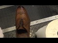 Mr Willie performing first shine on Allen Edmonds, While Mr James performing cleaning on my Nike sh