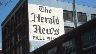195 Things: Written in black and white, The Herald News sign