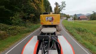 C15 STRAIGHT PIPES moving a 60,000lb excavator on tight roads