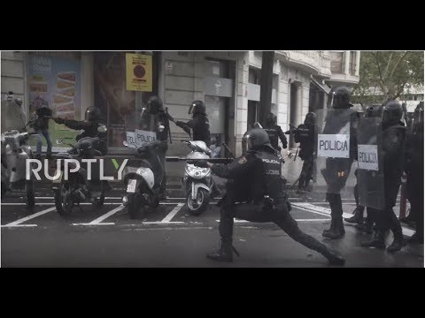 Spain: Pellets fly as police and voters come to blows in Barcelona