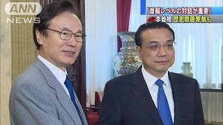「首脳レベルの対話重要」　谷内局長と李首相が会談(15/07/18)