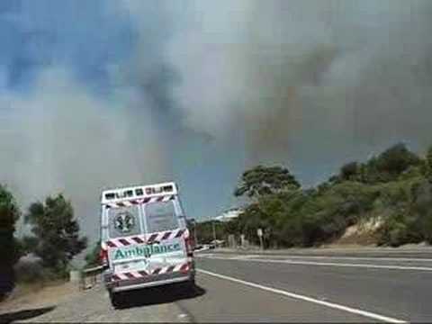 11/10/06 Footage of a grass fire started in Port Lincoln, South Australia. Includes radio communications between ground crews and water bombing and spotting aircraft.