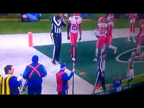 Marcus Peters throws the referees flag into the stands