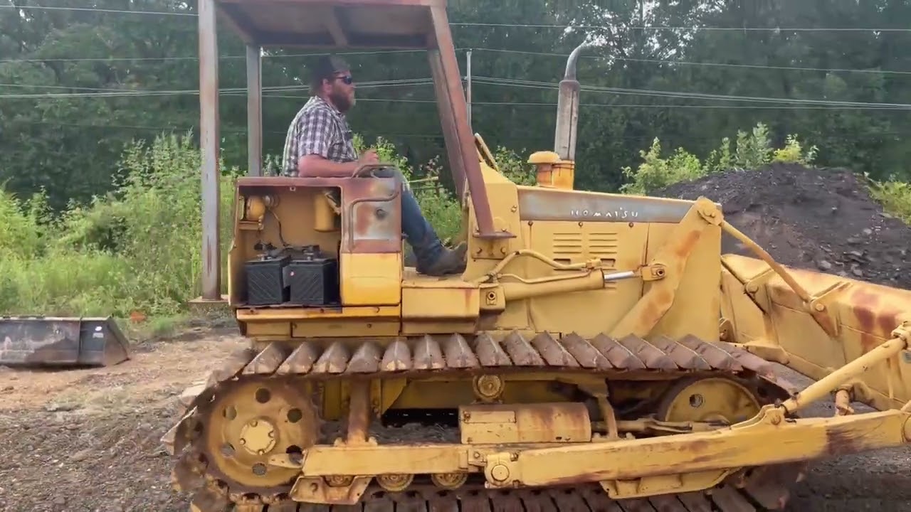 Bulldozer Komatsu D31P Spreading Dirt