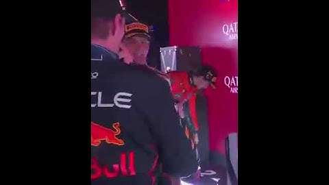 Max Verstappen and Red Bull’s principal strategy engineer Hannah Schmitz celebrate on the podium 👏🍾