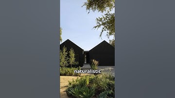 Nestled in the serene landscape of Australia, this minimalist home blends with naturalistic gardens.