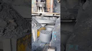 Title Satisfying Industrial Process: Making Coal Briquettes With Heavy Machinery