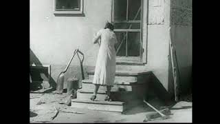 Woman Sweeping Front Steps After Dust Storm (1936) | Daily Life Amid Dust Bowl Hardship