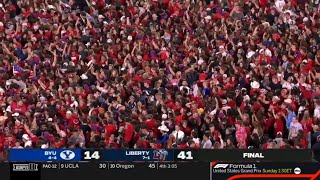 Liberty fans storm the field after beating BYU