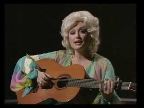 Dolly Parton playing a guitar