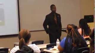Delivering a motivational speech about the Ronald E. McNair Scholars Program