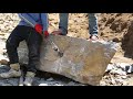 People using Chisel and Hammer to Break the Rock