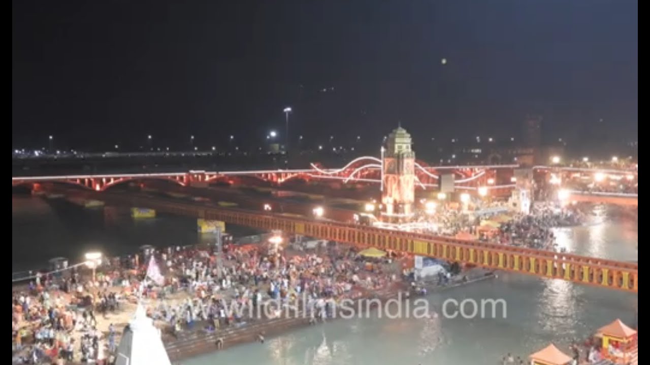 Ganga Ghat at night during Haridwar Kumbh Mela 2021 - Shiv Dhanush Bridge illuminated