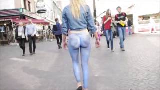 Girl walks busy street naked France